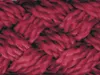 A close-up, detailed view of a braided red rope. Produktbild-Vorschau