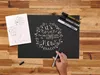A hand is shown writing on a black surface with a white marker, next to a sketchpad and three markers. Anteprima dell’immagine prodotto