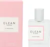A pink perfume box and a clear glass perfume bottle with a white cap are displayed side-by-side against a white background. Podgląd zdjęcia produktu