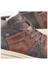 A close-up view of a brown leather boot. Voir les images du produit
