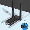 A black USB Wi-Fi adapter with two antennas is shown with angles indicated by text overlays. Produktbild-Vorschau
