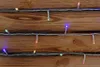 A close-up view of LED string lights draped across a wooden surface. Produktbild-Vorschau