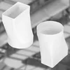 Two white plastic pipe connectors are shown against a blurred industrial background. Anteprima dell’immagine prodotto