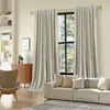 A living room scene with a sofa, armchair, dresser, and curtains. Anteprima dell’immagine prodotto
