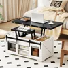 A lift-top coffee table is shown in a living room setting, with a laptop and coffee cup on its extended surface. Voir les images du produit