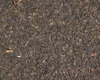 A close-up, overhead view of loose-leaf black tea. Anteprima dell’immagine prodotto