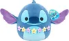 A plush toy of the character Stitch from Disney's Lilo & Stitch, wearing a flower lei. Voir les images du produit