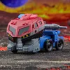 A toy robot in vehicle mode, resembling a truck, on a textured surface with a fiery, planetary background. Anteprima dell’immagine prodotto