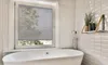 A bathroom with a bathtub and a window with blinds. Produktbild-Vorschau
