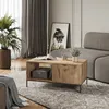 A living room scene featuring a coffee table with a book, cup, and plant. Produktbild-Vorschau