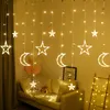 A room decorated with string lights featuring stars and moons, with a sofa and balloons in the background. Produktbild-Vorschau