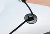 A close-up view of a black rope threaded through a black fitting on a white surface, likely part of an inflatable boat. Anteprima dell’immagine prodotto