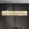 A rectangular crystal chandelier hangs over a dining table. Náhľad obrázku produktu