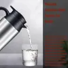 Water being poured from a kettle into a glass. Náhled obrázku produktu