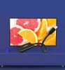 A product shot of a Ugreen adapter in front of a screen displaying fruit slices, set against a blue background. Voir les images du produit