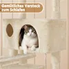 A cat is resting inside a beige cat tree, with text overlay indicating it's a cozy sleeping spot. Produktbild-Vorschau