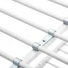 A close-up view of the white metal frame of a bunk bed, showing the connection points between the horizontal bars. Produktbild-Vorschau