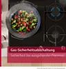 A gas stove with a wok cooking vegetables. Produktbild-Vorschau