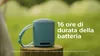 A teal Sony speaker sits on a wooden stump outdoors, with green foliage in the background. Voir les images du produit