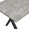 A close-up view of a table with a concrete-like top and black X-shaped legs. Produktbild-Vorschau