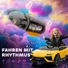 A child is happily riding in a yellow toy car with a colorful, cloudy sky background and musical notes. Produktbild-Vorschau