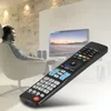 A man sits in a chair in a modern living room, holding a remote control and looking at a television. Náhľad obrázku produktu