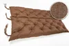 A brown tufted bench cushion with ties is shown against a white background. A circular inset shows a close-up of the fabric texture. Produktbild-Vorschau