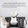 A coffee brewing set displayed on a textured background. Voir les images du produit