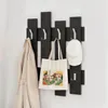 A coat rack with items hanging on it. Produktbild-Vorschau