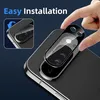 A hand is shown placing a clear screen protector over the camera lens of a smartphone. Produktbild-Vorschau