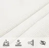Close-up of white fabric with icons indicating product features. Produktbild-Vorschau