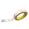 A roll of double-sided tape with the tape partially unrolled. Produktbild-Vorschau