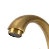 A close-up shot of a faucet spout with a brass finish. Podgląd zdjęcia produktu