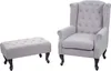A grey armchair and ottoman are displayed against a white background. Náhled obrázku produktu