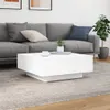 A white coffee table is placed in front of a gray sofa in a living room setting. Anteprima dell’immagine prodotto