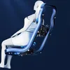 A 3D rendering of a white mannequin sitting in a black and blue massage chair against a dark blue background. Voir les images du produit