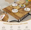 A dining table set with plates and glasses, with a close-up inset showing a hand wiping the surface with a wet wipe. Podgląd zdjęcia produktu