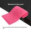A pink silicone keyboard is shown with water droplets on it, suggesting it is waterproof. The background is dark with a diagonal white stripe. Text overlays highlight features. Podgląd zdjęcia produktu