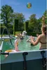 Children playing in a pool with inflatable toys. Náhled obrázku produktu
