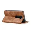 A brown flip case for a smartphone, shown from the side with the phone inserted. Produktbild-Vorschau