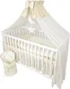 A baby crib with bedding and a canopy. Náhled obrázku produktu