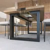 A dining table with a glass insert and metal legs, surrounded by chairs in a modern kitchen setting. Produktbild-Vorschau