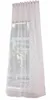 A sheer curtain with pompom details hanging in front of a window. Produktbild-Vorschau
