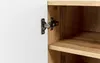 A close-up view of a cabinet hinge on a white door, attached to a wooden interior shelf. Náhľad obrázku produktu