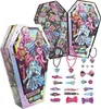 A Monster High advent calendar in a coffin-shaped box, with accessories laid out. Produktbild-Vorschau