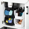 Storage bins filled with bathroom items inside a cabinet. Náhled obrázku produktu