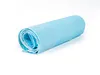 A rolled-up light blue training pad on a white background. Produktbild-Vorschau