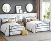 A bedroom scene with two beds, decorated with pillows and bedding. Podgląd zdjęcia produktu
