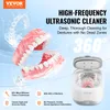 A collage advertising a high-frequency ultrasonic cleaner for dentures. It shows the cleaner itself, a pair of dentures, and text highlighting its features and benefits. Podgląd zdjęcia produktu
