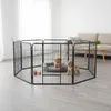 Two puppies are playing inside a black metal playpen in a living room. Anteprima dell’immagine prodotto